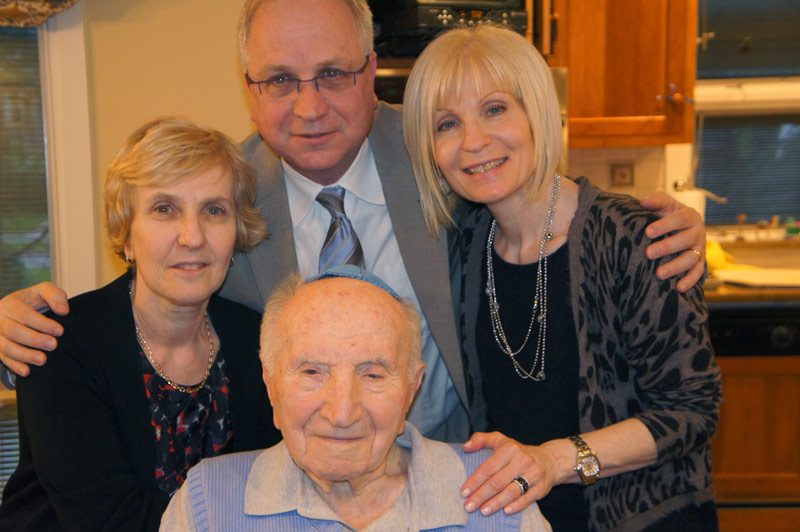 Morris Kotek Z”L with his three children (from left to right): Suzan, Freddie and Peggy 