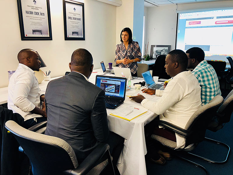 Members of the education team from Aegis Trust discuss creating IWitness activities with Lesly Culp, the Institute&#039;s head of educational programs. The visitors are, from left to right: Marc Gwamaka, Jean Nepo Ndahimana, Pierre Claver Irakoze and Enoch Ssemuwemba.