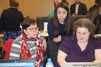 Teachers Johanna Soderholm and Emily Bengels with intern Natalia Smith, center