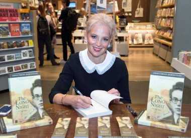 Noemie Lopian signs copies of her father&#039;s book. 